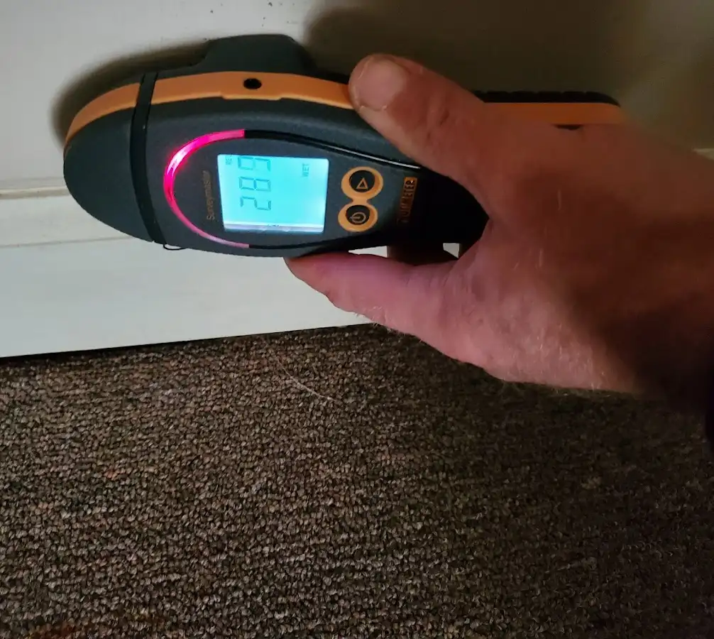 Moisture detection at baseboard during Storm Damage Restoration in Bridgton